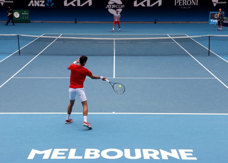 Serbia's Novak Djokovic hits a return during the ATP Cup team Serbia training session in Melbourne on February 1, 2021. (Photo by David Gray / AFP)