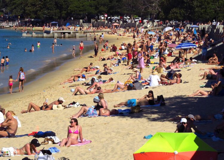 Beachgoers gather at Balmoral Beach amid ongoing social restrictions due to the pandemic in Sydney on September 12, 2021. (Photo by DAVID GRAY / AFP)