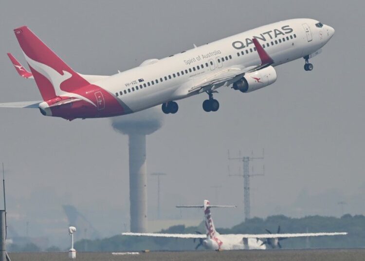 A Qantas Boeing 737-800 takes off from Sydney's Kingsford Smith airport in Sydney on November 1, 2019. (Photo by PETER PARKS / AFP)