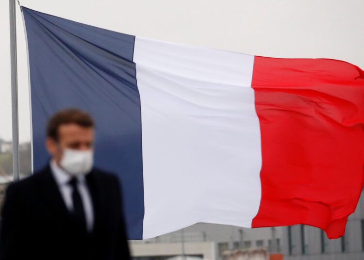 French President Emmanuel Macron arrives to the French frigate Bretagne before delivering his New Year wishes to the military forces in Brest, on January 19, 2021. (Photo by STEPHANE MAHE / POOL / AFP)