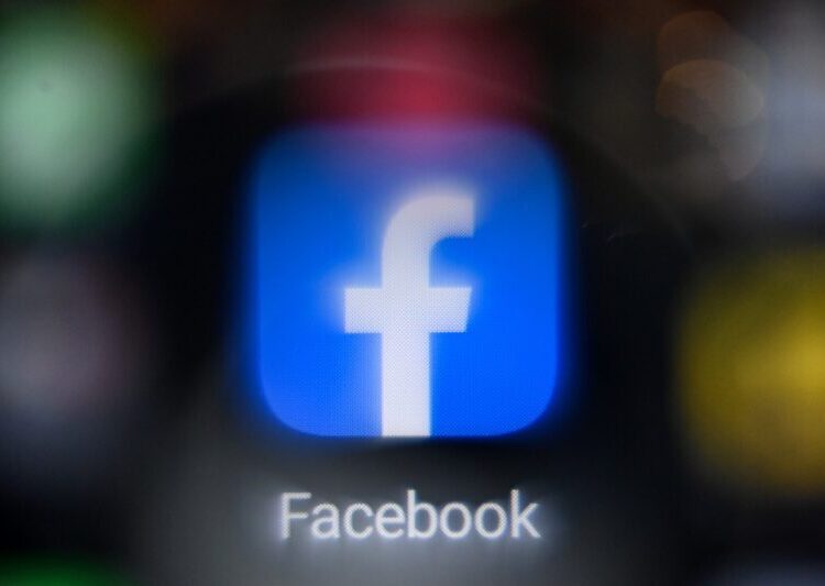 (FILES) In this file photo taken on November 19, 2021 a picture shows the US online social media and social networking service Facebook's logo on a smartphone screen in Moscow. - Ireland on March 15, 2022 imposed a fine on Facebook parent company Meta for breaching EU data privacy laws, in the latest action in Europe against the business practices of US tech titans. The fine against the social media giant, which owns WhatsApp, Instagram and Facebook, amounted to a total of 17 million euros ($18.7 million) following an inquiry into 12 data breaches, said the Data Protection Commission (DPC). (Photo by Kirill KUDRYAVTSEV / AFP)