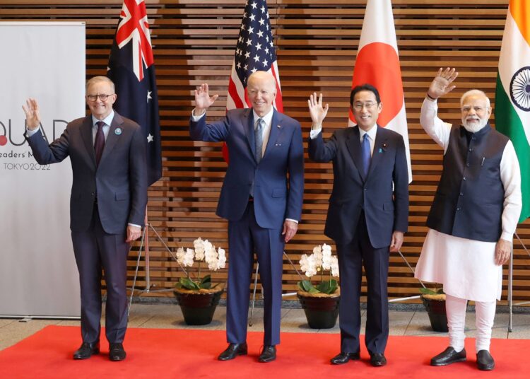 (L-R) Australian Prime Minister Anthony Albanese, US President Joe Biden, Japanese Prime Minister Fumio Kishida, and Indian Prime Minister Narendra Modi wave to the media prior to the Quad meeting at the Kishida's office in Tokyo on May 24, 2022. (Photo by STR / AFP)