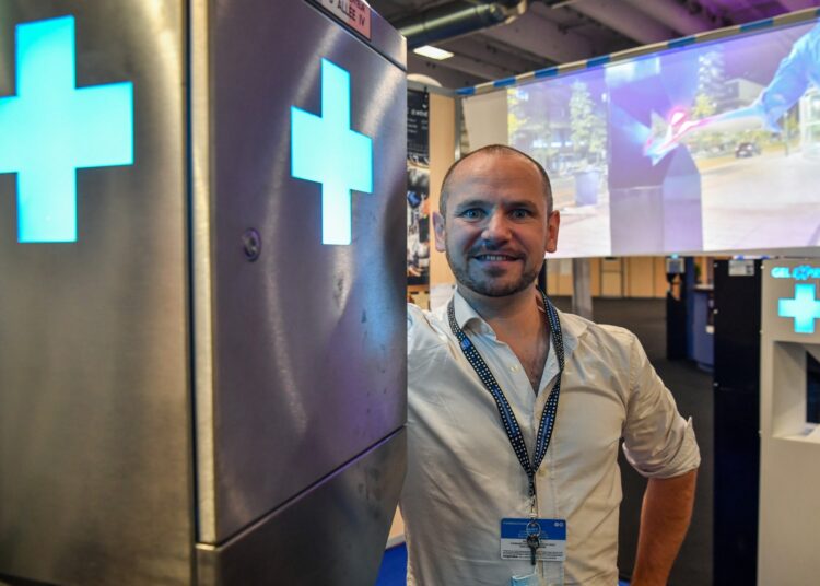 CEO Eric Le Mene of the company "Gel Express", a distribution terminal for Hydroalcoholic Gel for high-flow areas, poses on his stand at The Lepine contest as part of the Autumn fair in Paris on October 27, 2021. - The Lepine contest, a competition for inventors in the world, was launched in 1901 by Louis Lepine, the city's police chief and has chalked up some notable successes, such as the world's first artificial heart in 1937. (Photo by ALAIN JOCARD / AFP)