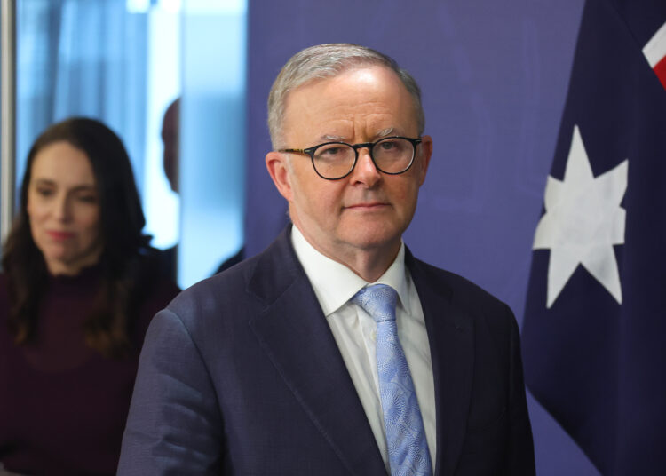 Australian Prime Minister Anthony Albanese (R) escorts New Zealand Prime Minister Jacinda Ardern for a joint press conference after a bilateral meeting in Sydney on June 10, 2022. (Photo by DAVID GRAY / AFP)