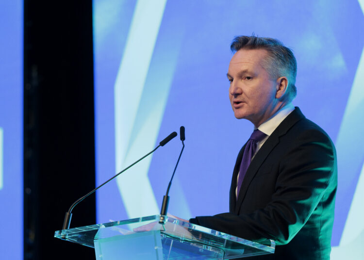 Chris Bowen, Australian Minister for Climate Change and Energy, speaks at the Sydney Energy Forum on July 12, 2022, in Sydney. - The Sydney Energy Forum brings together global leaders across government, industry, academia, technology and innovation to identify solutions to delivering clean energy supply chains across the Indo-Pacific. (Photo by Brook Mitchell / POOL / AFP)