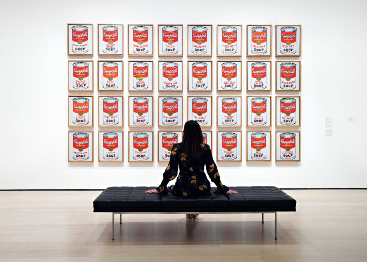 NEW YORK, NEW YORK - NOVEMBER 13: Andy Warhol's 'Campbell's Soup Cans' is on display during a press preview of MoMAs first ever Fall Reveal at Museum of Modern Art on November 13, 2020 in New York City. Cindy Ord/Getty Images/AFP (Photo by Cindy Ord / GETTY IMAGES NORTH AMERICA / AFP)
