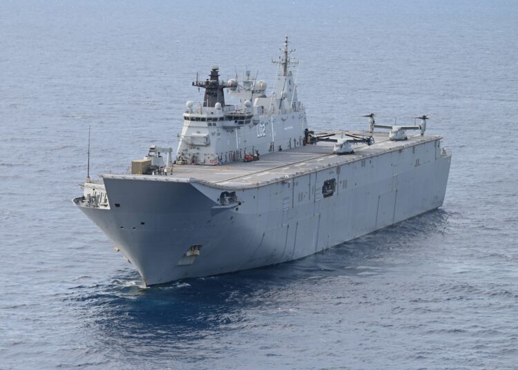 This photo shows an aerial shot of HMAS Canberra off Palawan on August 21, 2023, as a part of the Indo-Pacific Endeavor 2023 between the Armed Forces of the Philippines and the Australian Defence Force called Exercise Alon. - Australia's largest warship took part in joint drills with the Philippines and the United States in the disputed South China Sea on August 21, as they seek to strengthen defence ties in the face of China's growing military presence. (Photo by JAM STA ROSA / AFP)