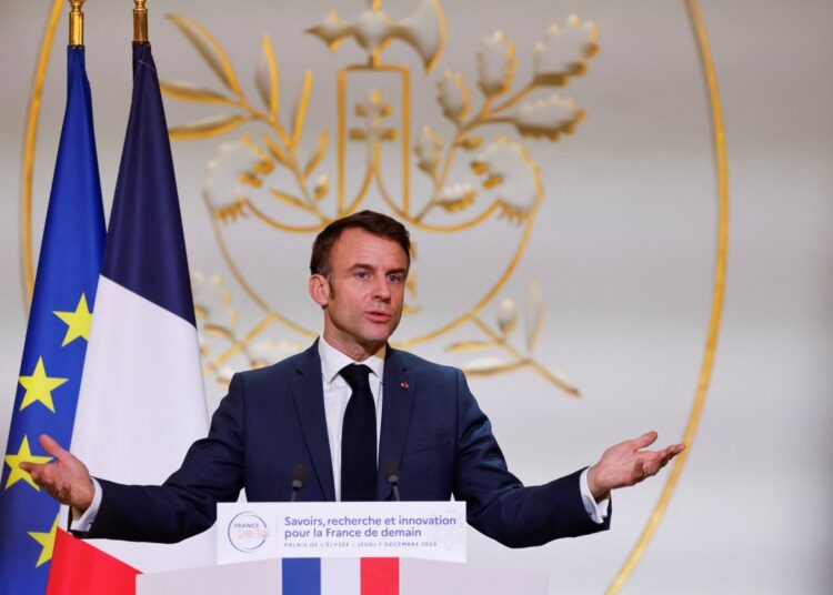 French President Emmanuel Macron gestures as he speaks during a meeting with more than 300 members of the research community, about the vision of the future of the French research at the Presidential Elysee Palace in Paris, on December 7, 2023. (Photo by Ludovic MARIN / POOL / AFP)