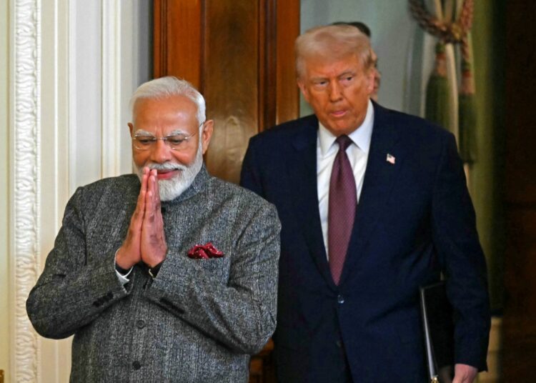 US President Donald Trump and Indian Prime Minister Narendra Modi arrive to hold a joint press conference in the East Room of the White House in Washington, DC, on February 13, 2025. (Photo by ANDREW CABALLERO-REYNOLDS / AFP)
