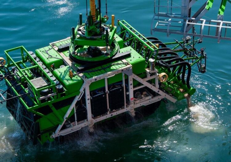 Patania II, a 25-tonne seabed mining robot, is lowered into the Pacific Ocean. Credit: DEME.