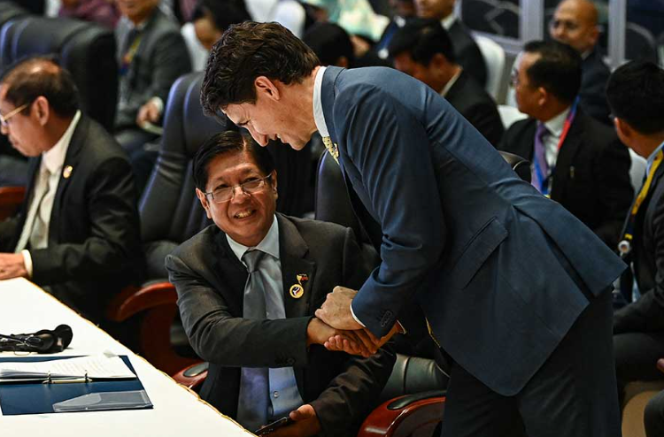 File image of Canadian Prime Minister Justin Trudeau and Philippines President Ferdinand Marcos, Jr. NHAC NGUYEN / AFP