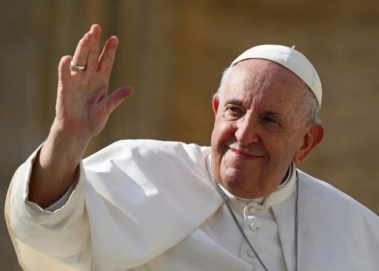 (FILES) Pope Francis (L) waves at the end of his weekly general audience at Saint Peter's Square in the Vatican on October 26, 2022. Pope Francis died on April 21, 2025 announced The Vatican. (Photo by Vincenzo PINTO / AFP)