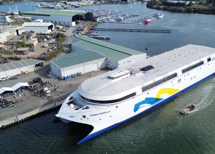 This handout photo taken and released on May 2, 2025 by Incat Tasmania shows an aerial view of the launch of the Hull 096 aluminium catamaran, the worlds largest battery-electric ship, at the Incat shipyard in Hobart in Australia's island state of Tasmania. An Australian boatbuilder launched what it described as the world's largest electric-powered ship on May 2, a 130-metre-long behemoth capable of carrying 2,100 passengers. (Photo by Handout / Incat Tasmania / AFP) / NO USE AFTER JUNE 1, 2025 10:09:01 GMT - NO USE AFTER JUNE 1, 2025 10:09:01 GMT - RESTRICTED TO EDITORIAL USE - MANDATORY CREDIT "AFP PHOTO / INCAT TASMANIA" - NO MARKETING NO ADVERTISING CAMPAIGNS - DISTRIBUTED AS A SERVICE TO CLIENTS - NO ARCHIVES /