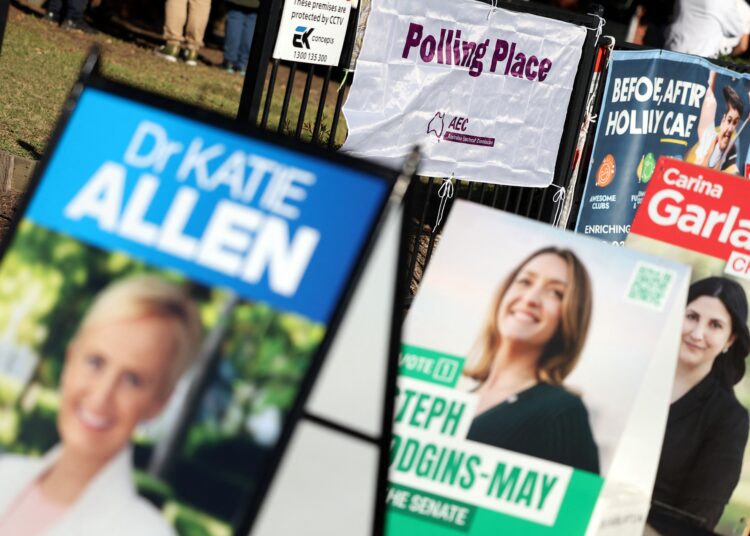 A sign displays the message 'polling place' during Australias general election at a polling station in Melbourne on May 3, 2025. (Photo by Martin KEEP / AFP)